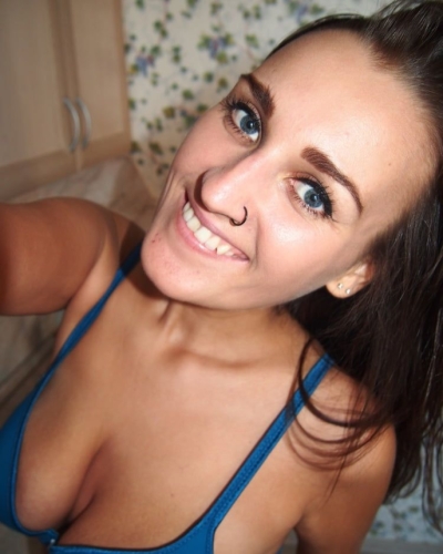 Brunette squeezes her big tits and takes hot naked selfies