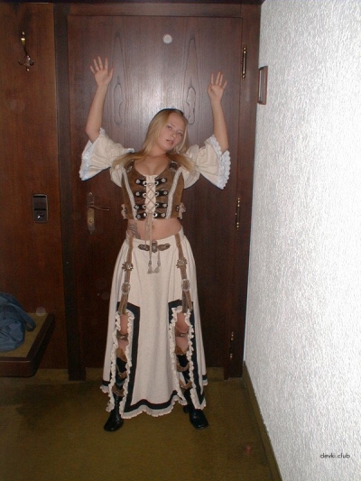 The blonde takes off her dress and masturbates