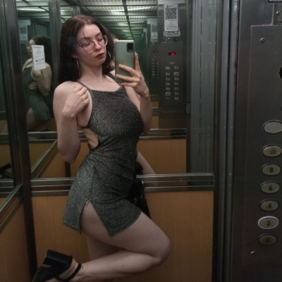 The beautiful naked body of a girl wearing glasses