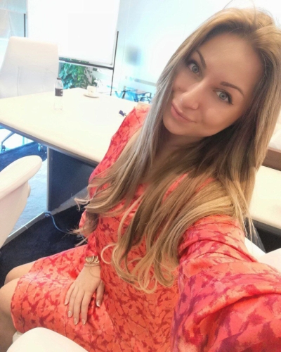 Young slender woman takes candid selfies for you