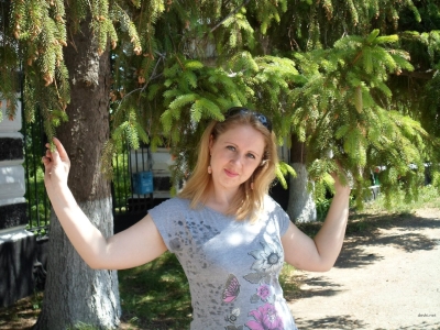 A seductive young beauty shows off her collection of intimate photos