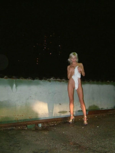 Slut posing in garage co-op