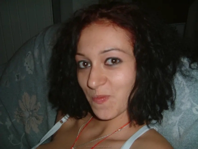 A red-haired girl passionately fucks with two guys