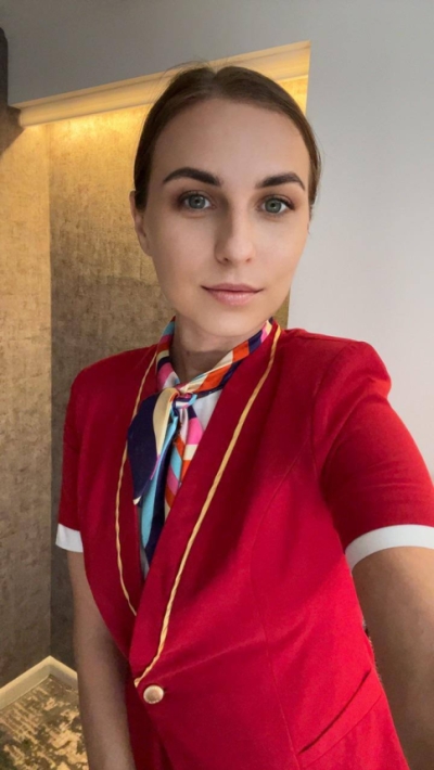 Sexy flight attendant gets naked between flights.