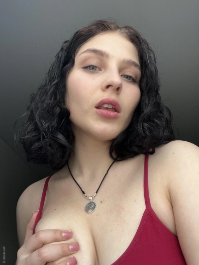 She showed herself by taking pictures in front of the mirror and on the bed