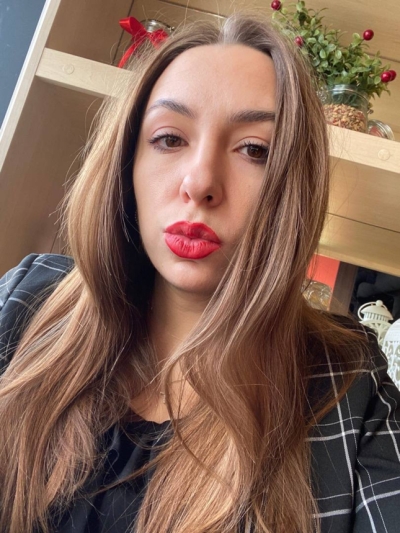 A girl taking nude pictures of herself