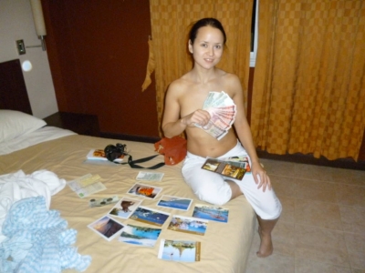 Oriental beauty with small breasts poses in the hotel