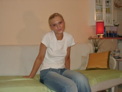 Blonde masturbates her shaved pussy with a phallus