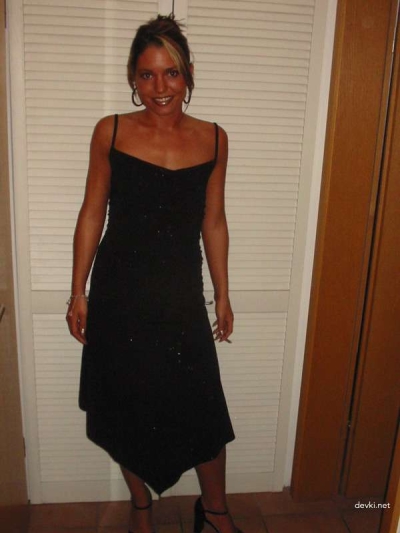 A seductive tanned girl is not shy about showing off her naked body.