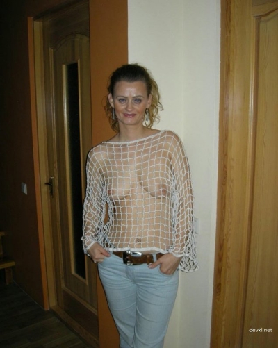 Naked woman shows her whole body in front of the camera